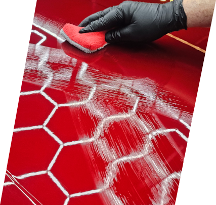 A person is cleaning the floor with red paint.