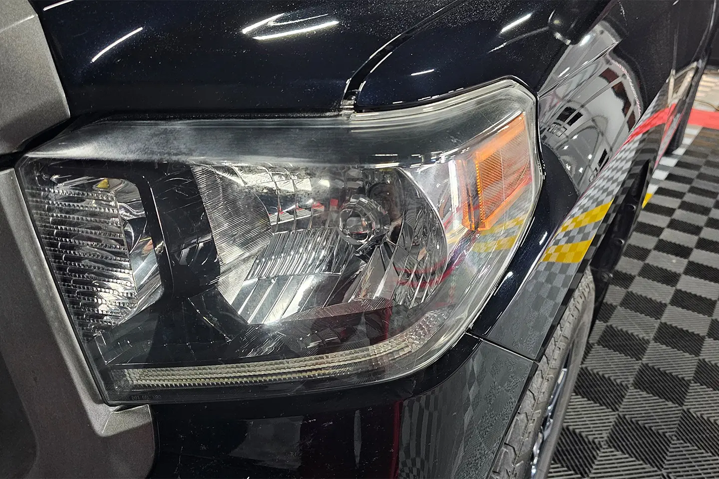 A close up of the headlight on a car