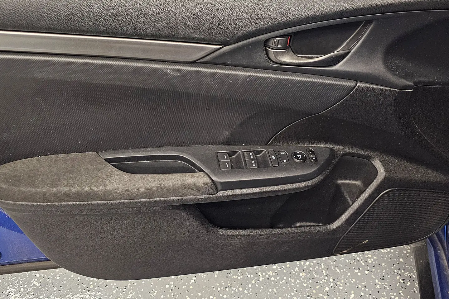 A close up of the door handle on a car