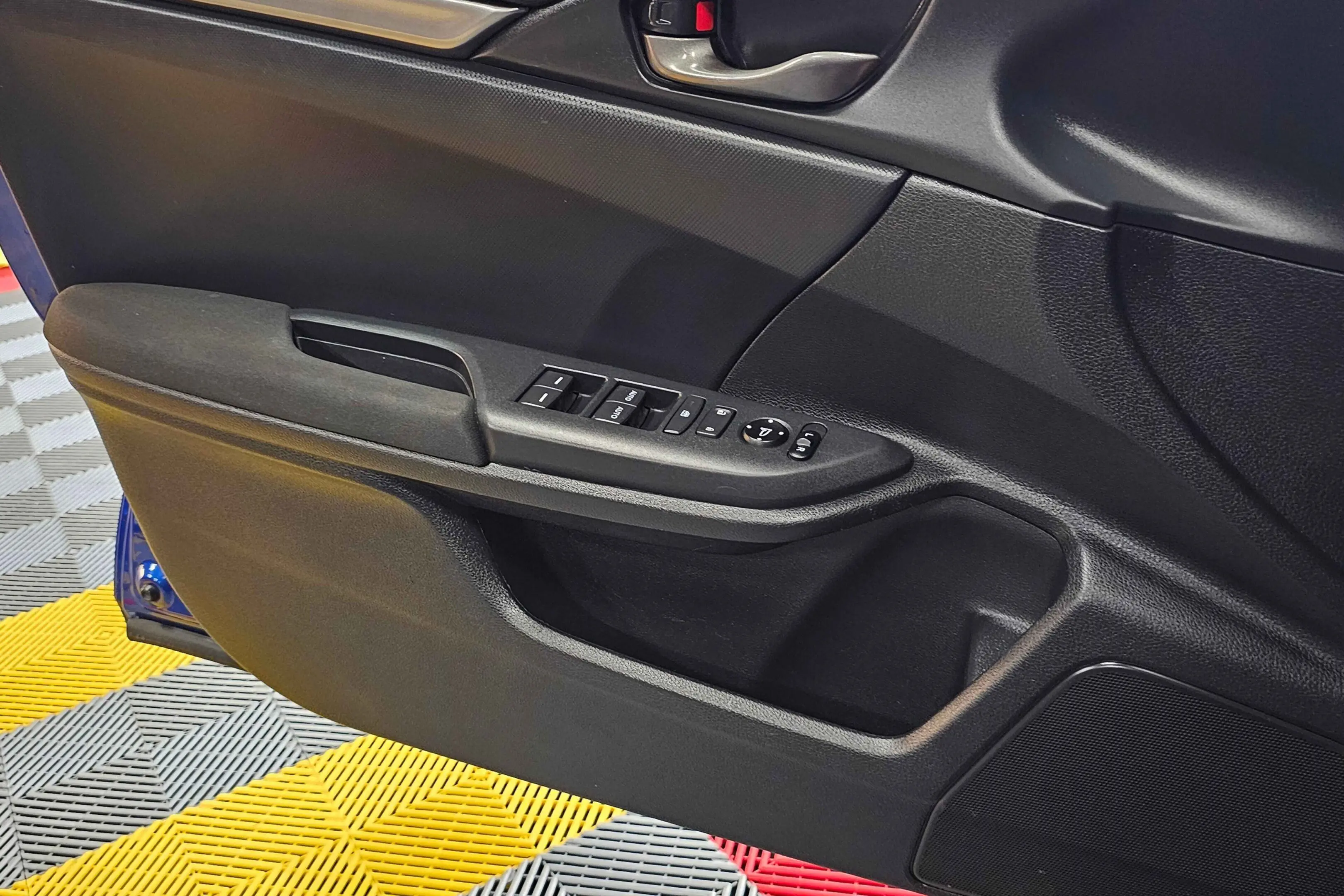 A close up of the door handle on a car