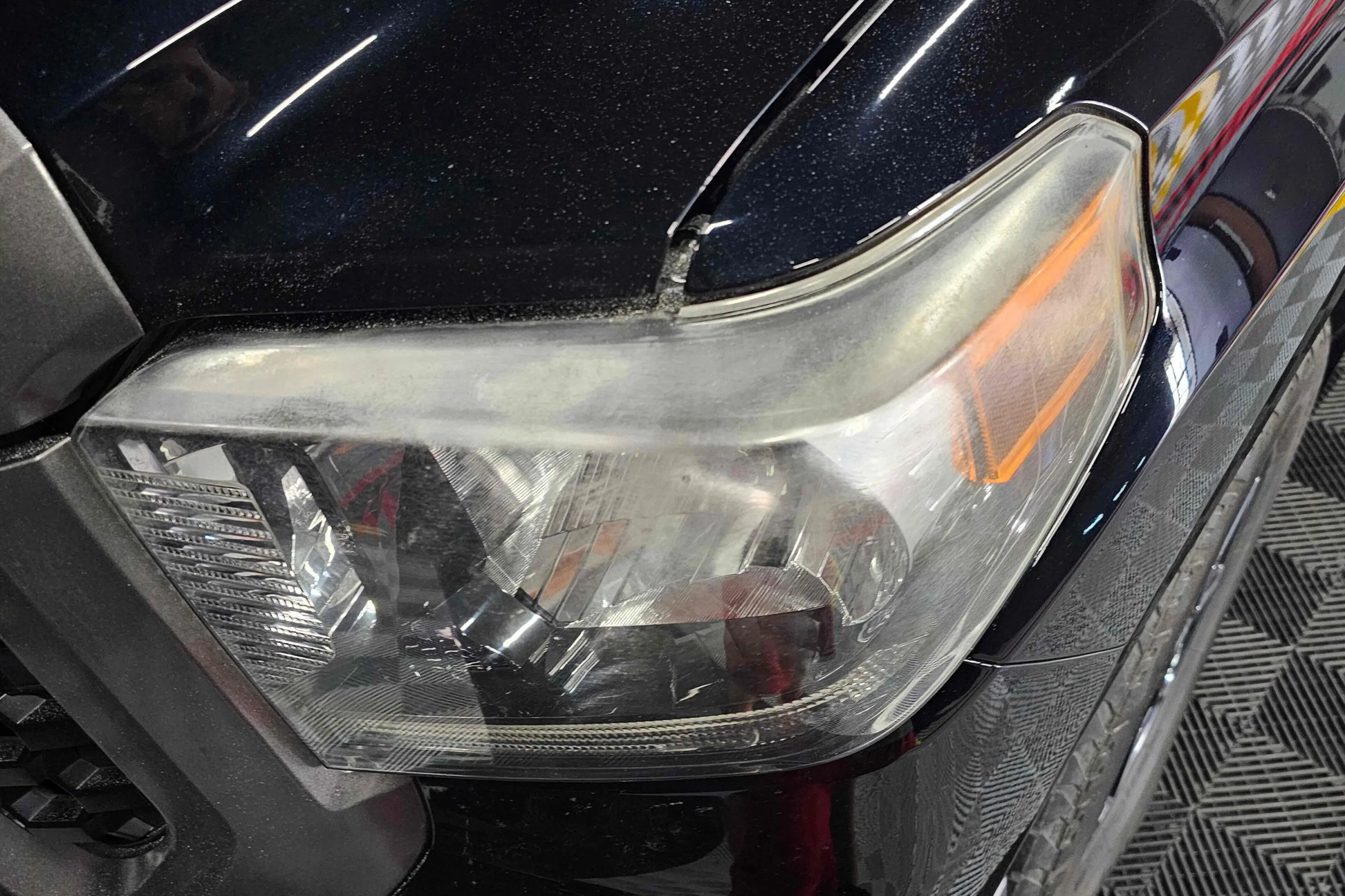 A close up of the headlight on a car